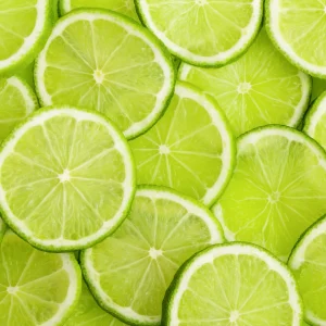 Green background with citrus-fruit of lime slices